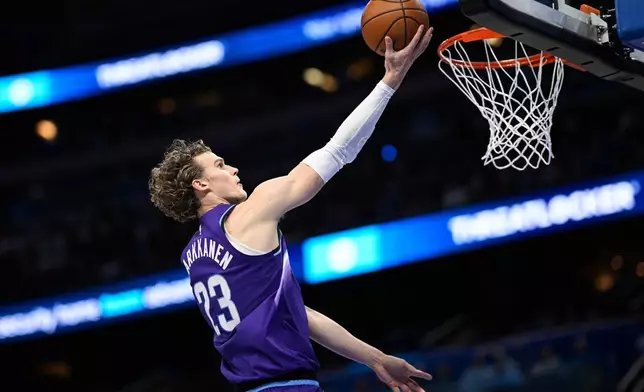 Utah Jazz forward Lauri Markkanen (23) goes up to score against the Orlando Magic during the first half of an NBA basketball game, Saturday, Feb. 7, 2026, in Orlando, Fla. (AP Photo/Phelan M. Ebenhack)