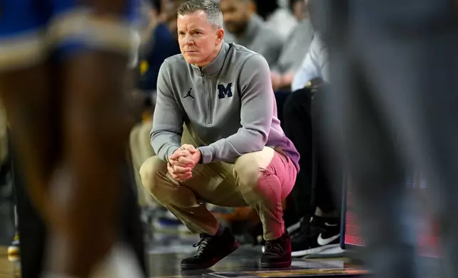 FILE - Michigan head coach Dusty May watches his team play UCLA in the first half of an NCAA college basketball game in Ann Arbor, Mich., Saturday, Feb. 14, 2026. (AP Photo/Lon Horwedel, File)