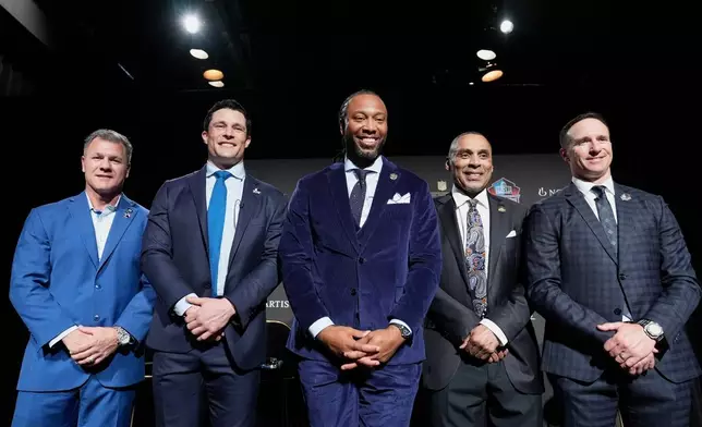 Adam Vinatieri, from left, stands with Luke Kuechly, Larry Fitzgerald, Roger Craig and Drew Brees after being announced for the Pro Football Hall of Fame class of 2026 during football's NFL Honors award show in San Francisco, Thursday, Feb. 5, 2026. (AP Photo/Brynn Anderson)