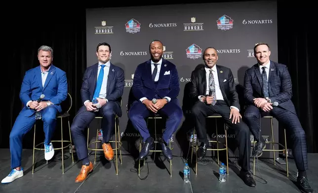 Adam Vinatieri, from left, sits with Luke Kuechly, Larry Fitzgerald, Roger Craig and Drew Brees after being announced for the Pro Football Hall of Fame class of 2026 during football's NFL Honors award show in San Francisco, Thursday, Feb. 5, 2026. (AP Photo/Brynn Anderson)