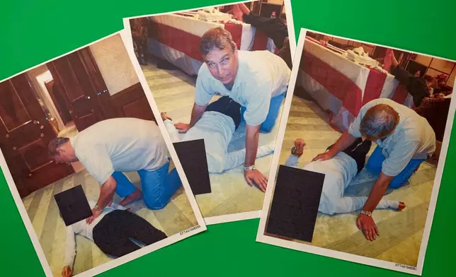 EDS NOTE: GRAPHIC CONTENT - Images from an undated and redacted document released by the U.S. Department of Justice, photographed Saturday, Jan. 31, 2026, show Andrew Mountbatten-Windsor, formerly known as Prince Andrew, leaning over an unidentified person. (AP Photo/Jon Elswick)