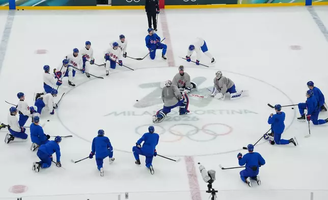 The United States men's ice hockey team gathers on the ice during practice at the 2026 Winter Olympics, in Milan, Italy, Sunday, Feb. 8, 2026. (AP Photo/Carolyn Kaster)