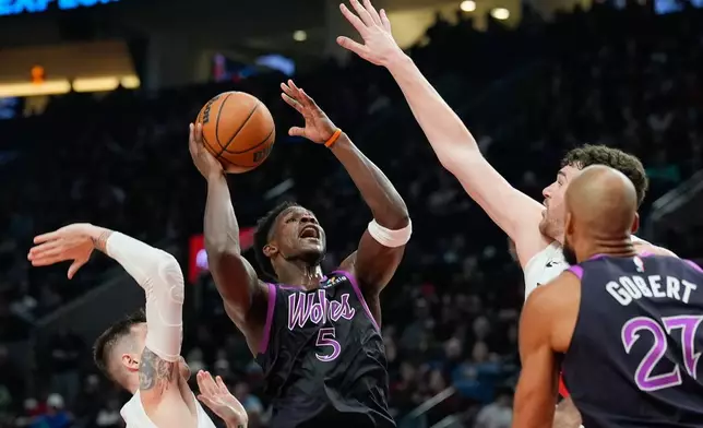 Minnesota Timberwolves guard Anthony Edwards (5) shoots during the first half of an NBA basketball game against the Portland Trail Blazers, Tuesday, Feb. 24, 2026, in Portland, Ore. (AP Photo/Jenny Kane)