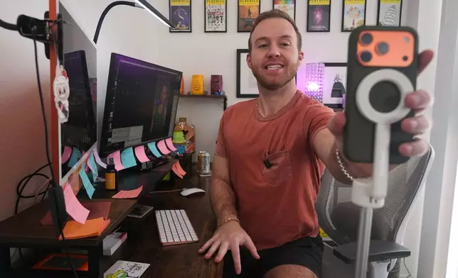 Niklaus Miller sits at his computer as he learns Bad Bunny's songs in preparation for Bad Bunny's Super Bowl halftime show at his home in the Hollywood section of Los Angeles Friday, Jan. 16, 2026. (AP Photo/Damain Dovarganes)