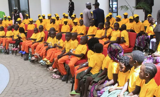 Freed church worshipers who were abducted by gunmen in Kurmin Wali, are seen upon their arrival at the state government house in Kaduna, Nigeria, Thursday, Feb. 5, 2026. (AP Photo/Abel Omotosho)