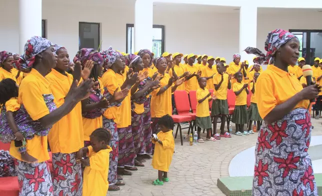 Freed church worshipers who were abducted by gunmen in Kurmin Wali, applaud upon their arrival at the state government house in Kaduna, Nigeria, Thursday, Feb. 5, 2026. (AP Photo/Abel Omotosho)