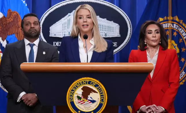 Attorney General Pam Bondi, center, flanked by FBI Director Kash Patel, left, and Jeanine Pirro, U.S. Attorney for the District of Columbia, appears before reporters at the Justice Department, Friday, Feb. 6, 2026, in Washington, to announce the capture of a key participant in the 2012 attack on a U.S. compound that killed four Americans in Benghazi, Libya. (AP Photo/J. Scott Applewhite)