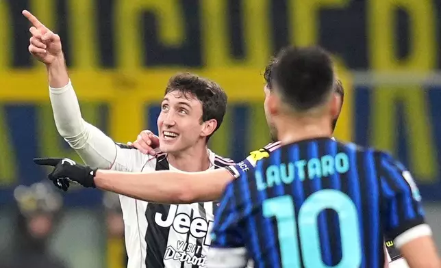 Juventus' Andrea Cambiaso celebrates after scoring his side's first goal during the Serie A soccer match between Inter and Juventus in Milan, Italy, Saturday, Feb. 14, 2025. (Spada/LaPresse via AP)