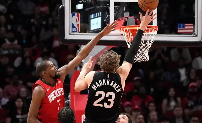 Houston Rockets forward Kevin Durant (7) defends against Utah Jazz forward Lauri Markkanen (23) during the first half of an NBA basketball game, Monday, Feb. 23, 2026, in Houston. (AP Photo/Karen Warren)