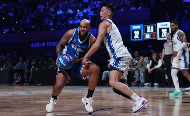Jeremy Lin, right, pressures Keenan Allen during an NBA basketball's All-Star Celebrity Game Friday, Feb. 13, 2026, in Inglewood, Calif. (AP Photo/Jae C. Hong)