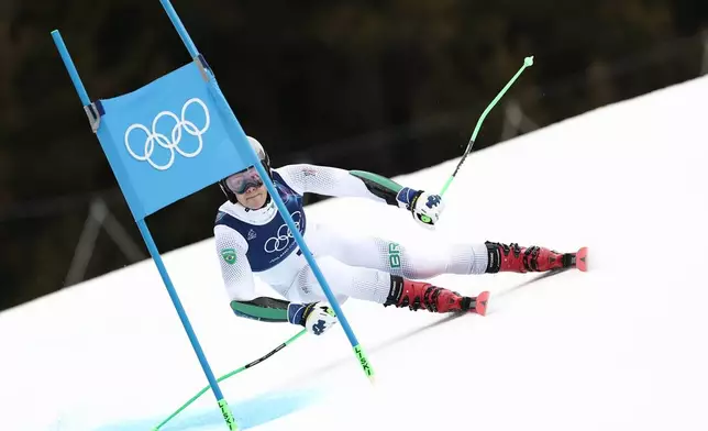 Brazil's Lucas Pinheiro Braathen speeds down the course, during an alpine ski, men's giant slalom race, at the 2026 Winter Olympics, in Bormio, Italy, Saturday, Feb. 14, 2026. (AP Photo/Gabriele Facciotti)