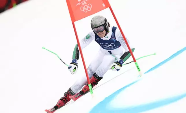 Brazil's Lucas Pinheiro Braathen speeds down the course, during an alpine ski, men's giant slalom race, at the 2026 Winter Olympics, in Bormio, Italy, Saturday, Feb. 14, 2026. (AP Photo/Gabriele Facciotti)