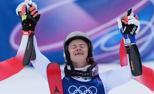 Brazil's Lucas Pinheiro Braathen celebrates winning an alpine ski, men's giant slalom race, at the 2026 Winter Olympics, in Bormio, Italy, Saturday, Feb. 14, 2026. (AP Photo/Julia Demaree Nikhinson)