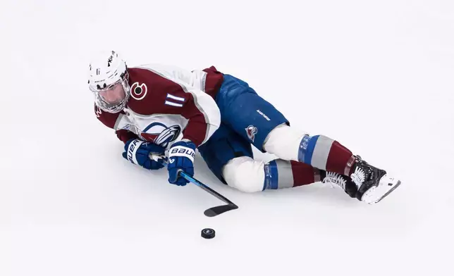 Colorado Avalanche center Brock Nelson plays the puck during the second period of an NHL hockey game against the Utah Mammoth, Wednesday, Feb. 25, 2026, in Salt Lake City. (AP Photo/Tyler Tate)