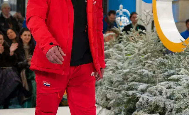 Vitomir Padovan of Croatia presents an outfit during a fashion show ahead of the 2026 Winter Olympics, in Milan, Italy, Wednesday, Feb. 4, 2026. (Xue Yuge/Pool Photo via AP)