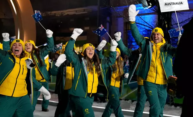 Team Australia arrives for the Olympic opening ceremony at the 2026 Winter Olympics, in Cortina d'Ampezzo, Italy, Friday, Feb. 6, 2026. (AP Photo/Misper Apawu)