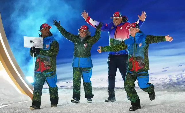 Athletes from Haiti walk during the Olympic opening ceremony at the 2026 Winter Olympics, in Livigno, Italy, Friday, Feb. 6, 2026. (AP Photo/Abbie Parr)