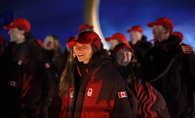 Athletes from Canada walk during the Olympic opening ceremony at the 2026 Winter Olympics, in Livigno, Italy, Friday, Feb. 6, 2026. (Cameron Spencer/Pool Photo via AP)
