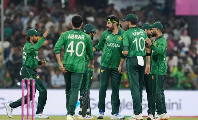 Pakistan's Usman Tariq, centre, celebrates with teammates the wicket of United States' Milind Kumar during the T20 World Cup cricket match between Pakistan and the United States in Colombo, Sri Lanka, Tuesday, Feb. 10, 2026. (AP Photo/Eranga Jayawardena)
