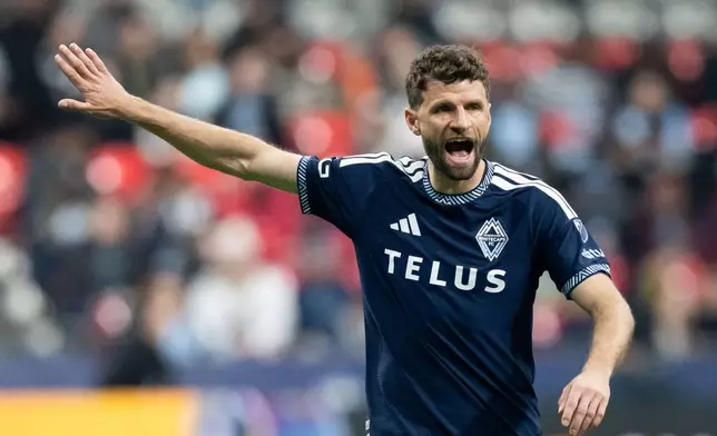 Vancouver Whitecaps' Thomas Muller (13) yells to his teammates during the first half of an MLS soccer match against Real Salt Lake in Vancouver, on Saturday, Feb. 21, 2026. (Ethan Cairns/The Canadian Press via AP)