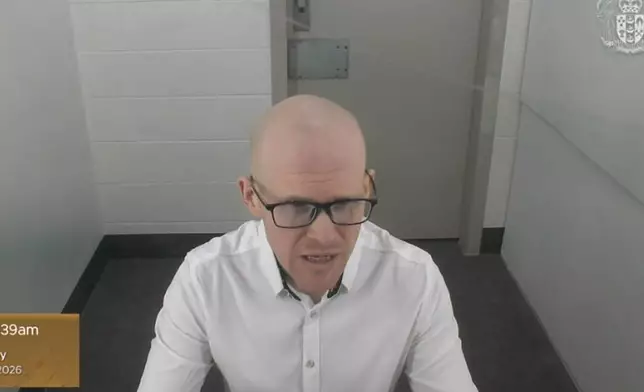 In this photo made from video and provided by the New Zealand Court of Appeal, Monday, Feb. 9, 2026, Brenton Tarrant appears before the court by video from Auckland Prison in Auckland. (New Zealand Court of Appeal via AP)