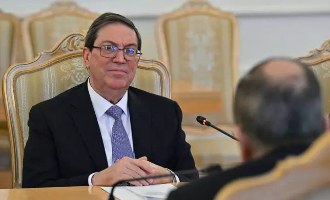 Cuban Foreign Minister Bruno Rodriguez, left, listens to Russian Foreign Minister Sergey Lavrov during their meeting in Moscow, Russia, Wednesday, Feb. 18, 2026. (Hector Retamal/Pool Photo via AP)