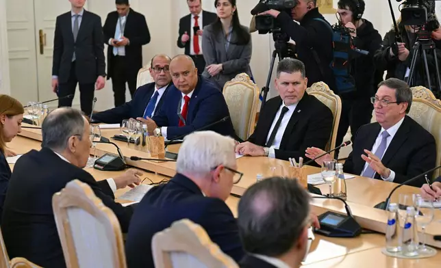 Russian Foreign Minister Sergey Lavrov, 2nd left, meets with Cuban Foreign Minister Bruno Rodriguez, right, in Moscow, Russia, Wednesday, Feb. 18, 2026. (Hector Retamal/Pool Photo via AP)
