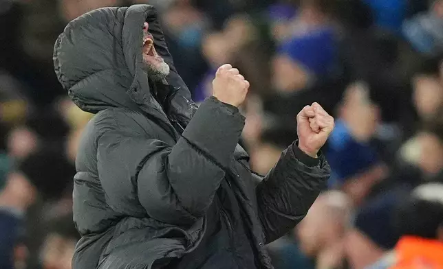 Manchester City manager Pep Guardiola celebrates their second goal during the English League Cup semifinal soccer match soccer match between Manchester City and Newcastle in Manchester, England, Wednesday, Feb. 4, 2026. (Martin Rickett/PA via AP)