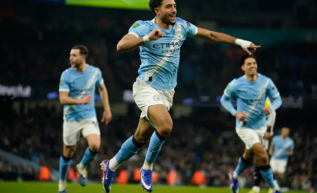 Manchester City's Omar Marmoush celebrates after scoring during the English League Cup semifinal soccer match soccer match between Manchester City and Newcastle in Manchester, England, Wednesday, Feb. 4, 2026. (AP Photo/Dave Thompson)