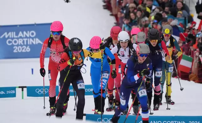 France's Emily Harrop, foreground, leads the group during a ski mountaineering mixed relay, at the 2026 Winter Olympics, in Bormio, Italy, Saturday, Feb. 21, 2026.(AP Photo/Rebecca Blackwell)