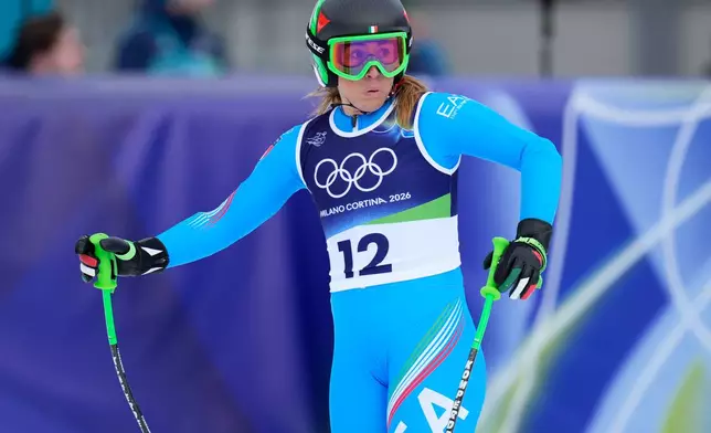 Italy's Sofia Goggia at the finish area during an alpine ski, women's downhill official training, at the 2026 Winter Olympics, in Cortina d'Ampezzo, Italy, Friday, Feb. 6, 2026. (AP Photo/Giovanni Auletta)