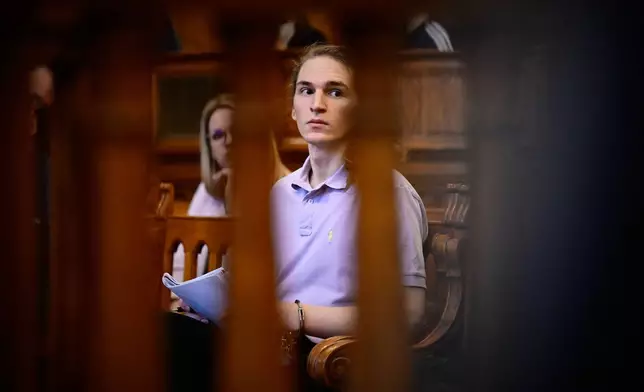 Maja T., a German anti-fascist activist, accused of assaulting and injuring neo-Nazis in Budapest in Feb. 2023, sits handcuffed after the verdict was read in court in Budapest, Hungary, Wednesday, Feb.4, 2026, at the Budapest-Capital Regional Court. (AP Photo/Denes Erdos)