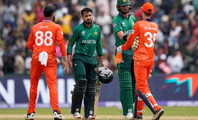 Netherlands' captain Scott Edwards, right, congratulates Pakistan's Shaheen Shah Afridi after Pakistan won their T20 World Cup cricket match against Netherlands in Colombo, Sri Lanka, Saturday, Feb. 7, 2026. (AP Photo/Eranga Jayawardena)