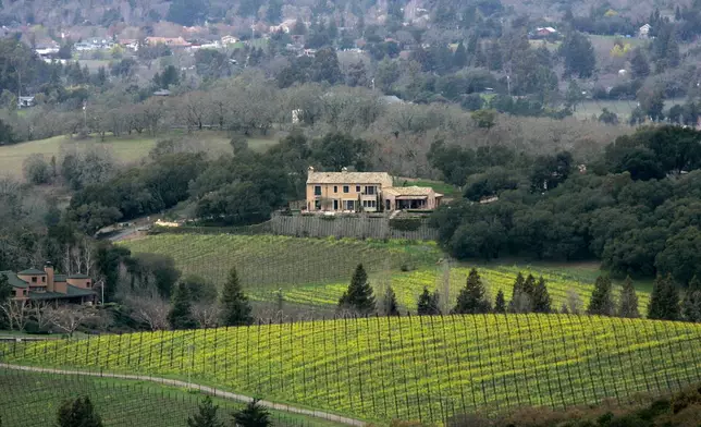 A residence sits on a hilltop overlooking a vineyard in Napa, Calif., Wednesday, Feb. 20, 2008. Beautiful Napa is experiencing foreclosures, plunging housing prices, unheard of drops in home sales and the nervous sense of foreboding that has spread across the country like a flu. (AP Photo/Marcio Jose Sanchez)
