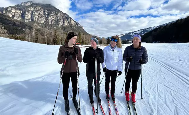 Australians from left, Emma Wilson,Hannah McAdam, Saskia Moon and Kaitlyn Rozic stop while skiing on the Marcialonga trail, during the 2026 Winter Olympics, in Tesero, Italy, Tuesday, Feb. 10, 2026. (AP Photo/Brian Melley)