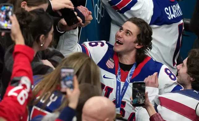 United States' Jack Hughes (86), who scored the winning overtime goal, celebrates after defeating Canada in the men's ice hockey gold medal game at the 2026 Winter Olympics in Milan, Italy, Sunday, Feb. 22, 2026. (AP Photo/Carolyn Kaster)