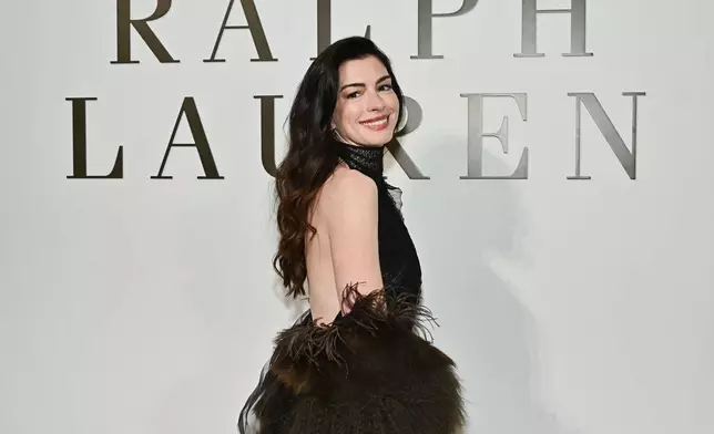 Anne Hathaway attends the Ralph Lauren Fall/Winter 2026 fashion show as part of New York Fashion Week on Tuesday, Feb. 10, 2026, in New York. (Photo by Evan Agostini/Invision/AP)
