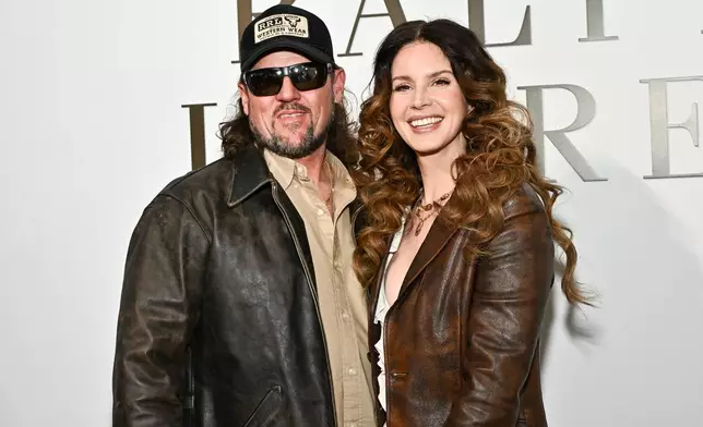 Lana Del Rey, right, and husband Jeremy Dufrene attend the Ralph Lauren Fall/Winter 2026 fashion show as part of New York Fashion Week on Tuesday, Feb. 10, 2026, in New York. (Photo by Evan Agostini/Invision/AP)