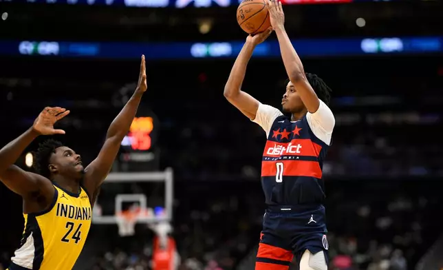 Washington Wizards guard Bilal Coulibaly (0) looks to shoot against Indiana Pacers guard Kobe Brown (24) during the second half of an NBA basketball game, Friday, Feb. 20, 2026, in Washington. (AP Photo/Nick Wass)