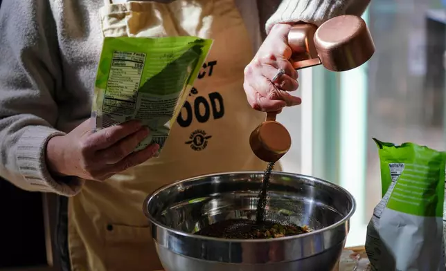 CEO of the Chef Ann Foundation, Mara Fleishman, a winner of this year's Elevate Prize, makes granola for her family at her home, Monday, Feb. 16, 2026, in Boulder, Colo. (AP Photo/Rebecca Slezak)