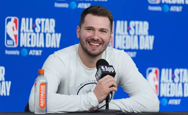 Los Angeles Lakers' Luka Doncic talks to reporters during the NBA All-Star basketball game media day Saturday, Feb. 14, 2026, in Inglewood, Calif. (AP Photo/Jae C. Hong)