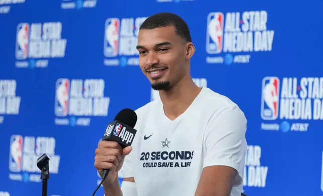 San Antonio Spurs' Victor Wembanyama talks to reporters during the NBA All-Star basketball game media day Saturday, Feb. 14, 2026, in Inglewood, Calif. (AP Photo/Jae C. Hong)