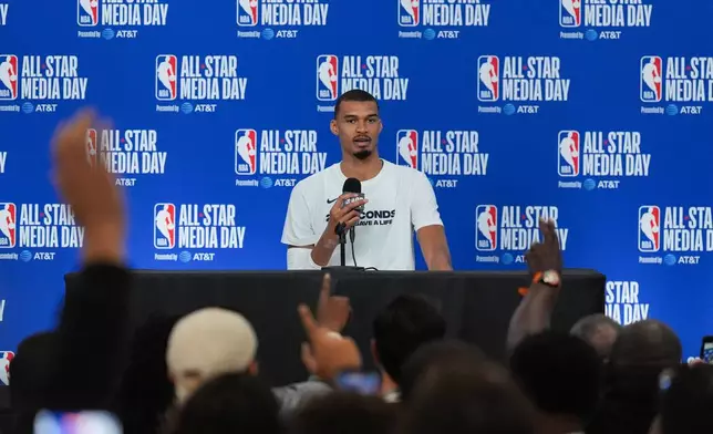 San Antonio Spurs' Victor Wembanyama talks to reporters during the NBA All-Star basketball game media day Saturday, Feb. 14, 2026, in Inglewood, Calif. (AP Photo/Jae C. Hong)