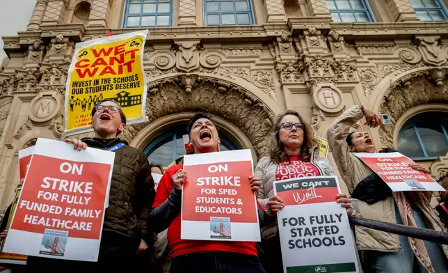 Math teacher Mar Martinez, center, joins teachers and San Francisco Unified School District staff join a city-wide protest to demand a fair contract while at Mission High School, Monday, Feb. 9, 2026, in San Francisco. (Brontë Wittpenn/San Francisco Chronicle via AP)