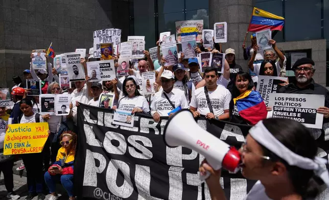 People who consider their detained family members to be political prisoners call for their releases outside the United Nations office in Caracas, Venezuela, Wednesday Feb. 18, 2026. (AP Photo/Ariana Cubillos)