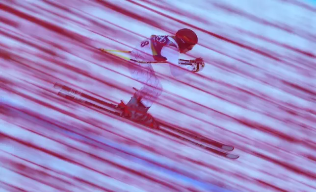 Slovakia's Rebeka Jancova speeds down the course during an alpine ski women's downhill training for a team combined race, at the 2026 Winter Olympics, in Cortina d'Ampezzo, Italy, Monday, Feb. 9, 2026. (AP Photo/Robert F. Bukaty)