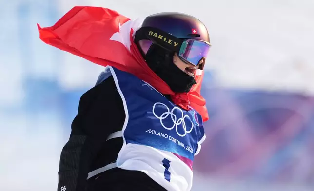 Switzerland's Mathilde Gremaud celebrates her gold medal win in the women's freestyle skiing slopestyle finals at the 2026 Winter Olympics, in Livigno, Italy, Monday, Feb. 9, 2026. (AP Photo/Lindsey Wasson)