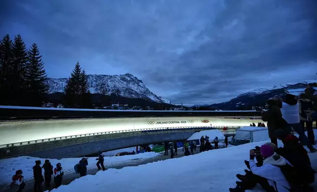 Germany's Merle Malou Fraebel slides down the track during a women's single luge run at the 2026 Winter Olympics, in Cortina d'Ampezzo, Italy, Monday, Feb. 9, 2026. (AP Photo/Alessandra Tarantino)