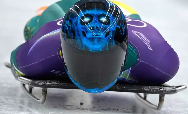 Australia's Nicholas Timmings starts for a men's skeleton training session at the 2026 Winter Olympics, in Cortina d'Ampezzo, Italy, Monday, Feb. 9, 2026. (AP Photo/Alessandra Tarantino)