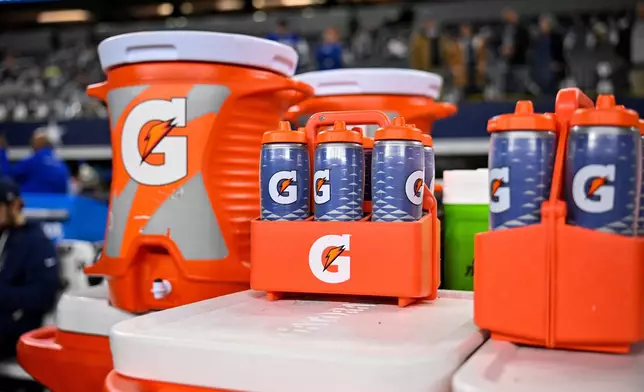 FILE - Gatorade bottles and coolers are seen on the sideline before an NFL football game between the Dallas Cowboys and the Minnesota Vikings, Dec. 14, 2025, in Arlington, Texas. (AP Photo/Jerome Miron, file)